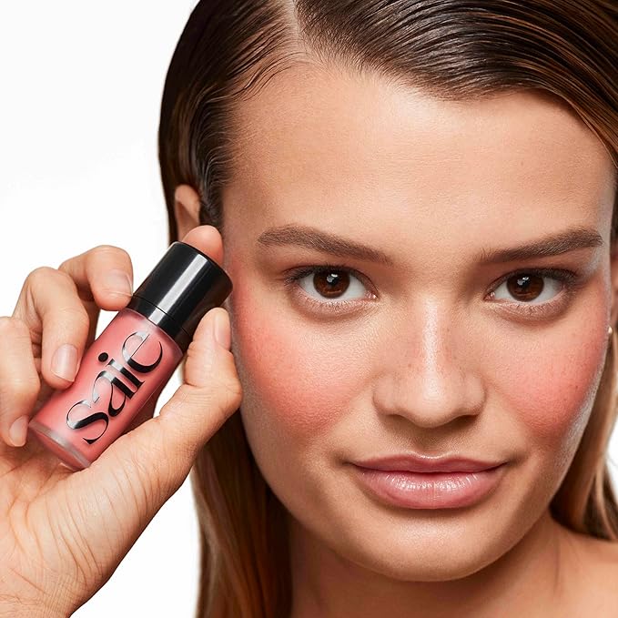 Saie Dew Blush - Lightweight Liquid Blush with a Blendable + Buildable Cream Finish - Dewy Cheek Tint with Doe Foot Wand Makeup Applicator - Neutral Pink Blush - Sweetie (.40 oz)